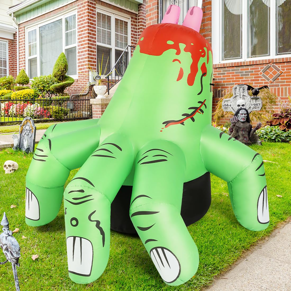 COMIN inflatable hand beside porch steps displaying 6ft scale for placement planning