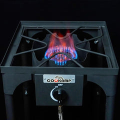 COOKAMP burner powering a griddle outdoors to deliver fast, even cooking heat