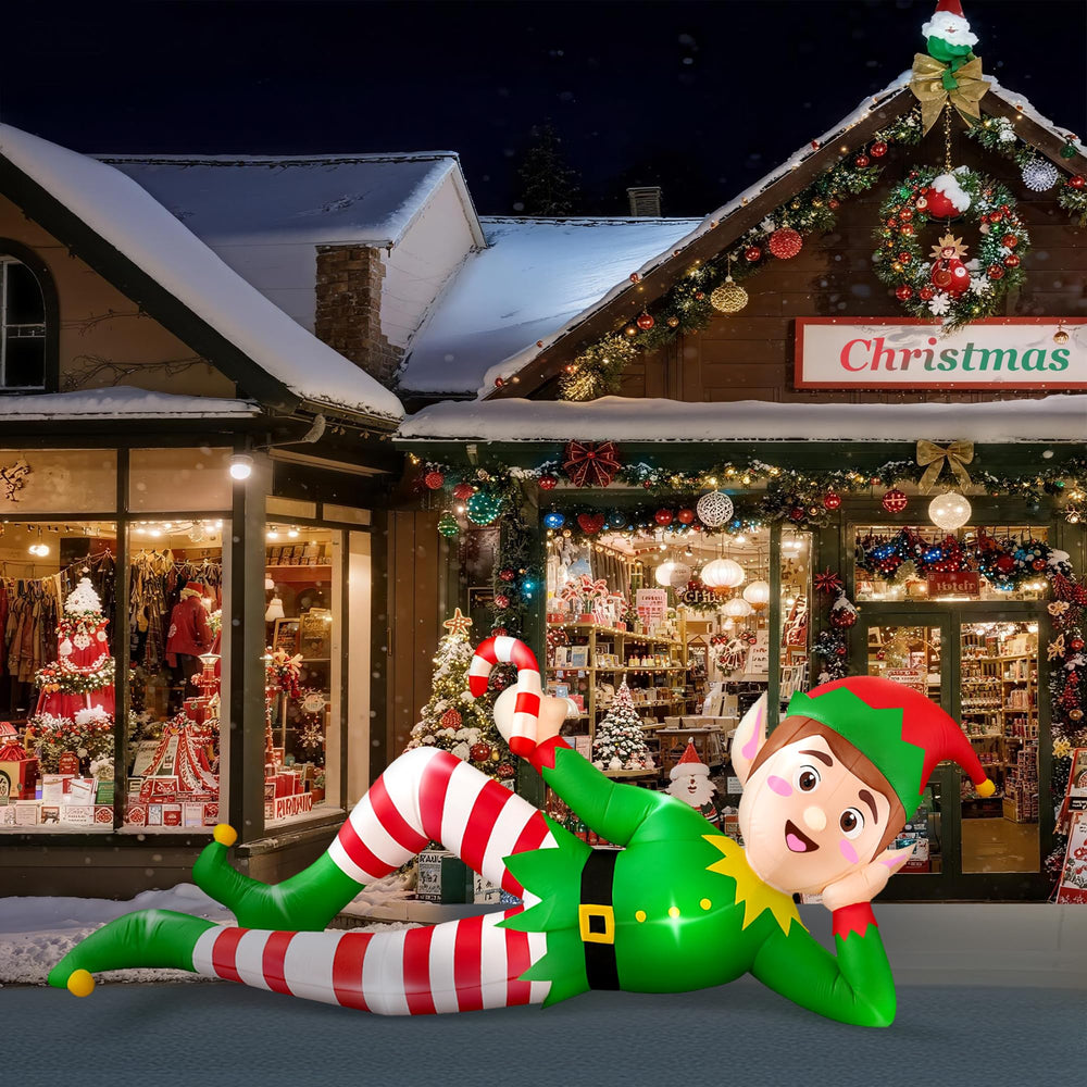 CORALMEE elf beside a person showing 8ft scale for size and visual impact