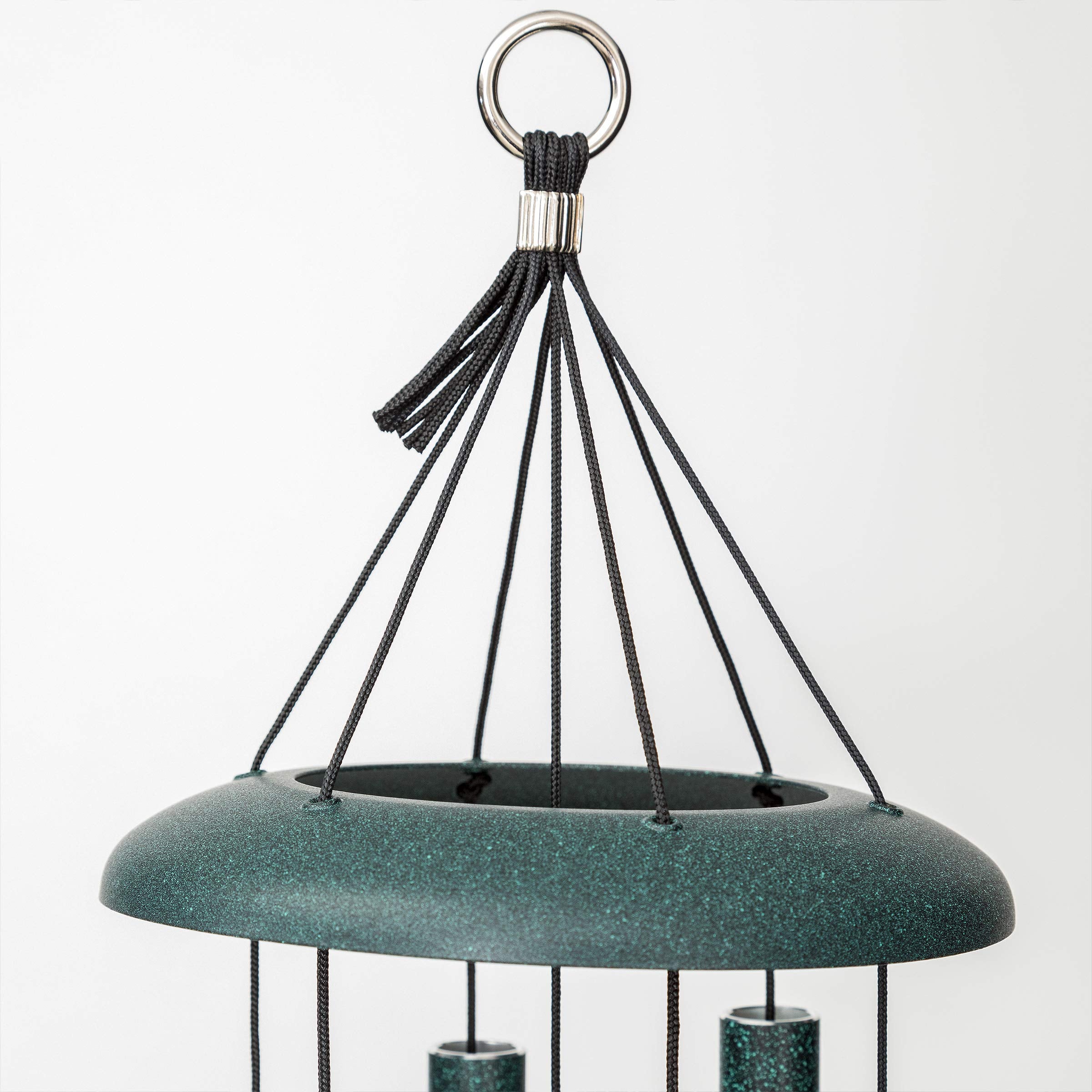 Corinthian Bells hanging in garden setting adding melodic atmosphere to patio