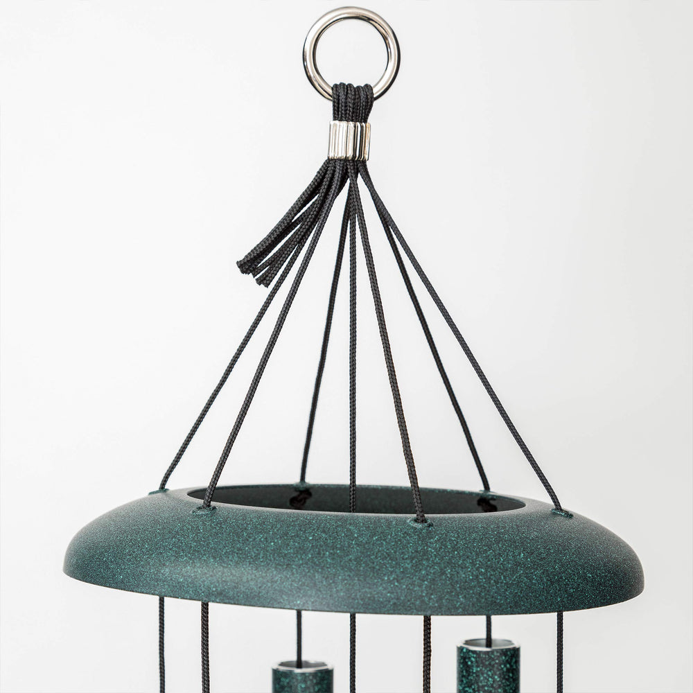 Corinthian Bells hanging in garden setting adding melodic atmosphere to patio