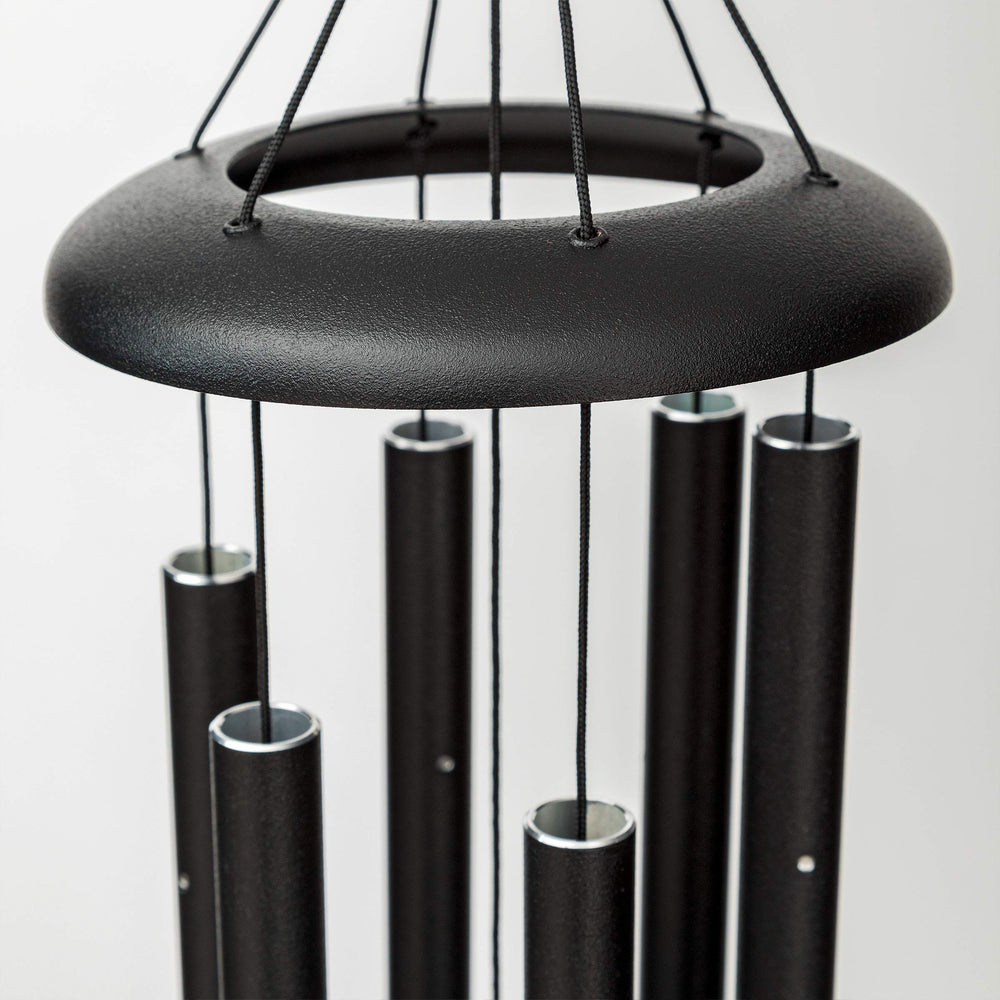 Corinthian Bells hanging on porch illustrating calming patio ambiance