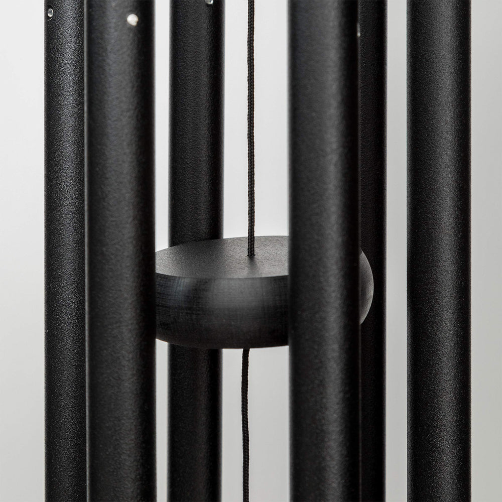 Corinthian Bells next to chair showing 27-inch scale and placement benefit