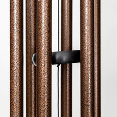 Corinthian Bells hanging in garden showing lifestyle placement and ambient sound benefit
