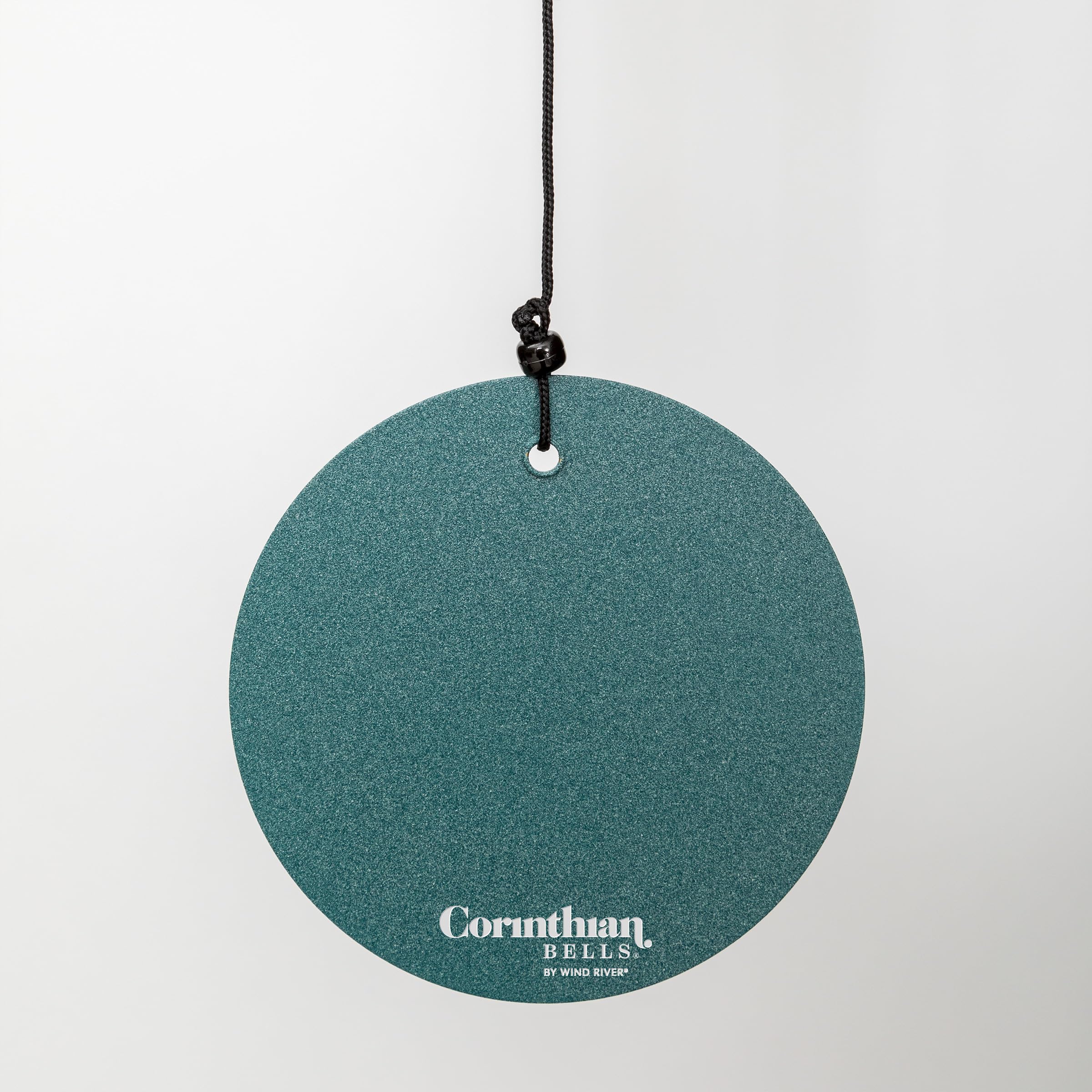 Corinthian Bells hanging on porch styling an outdoor space with soothing sound