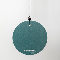 Corinthian Bells hanging on porch styling an outdoor space with soothing sound