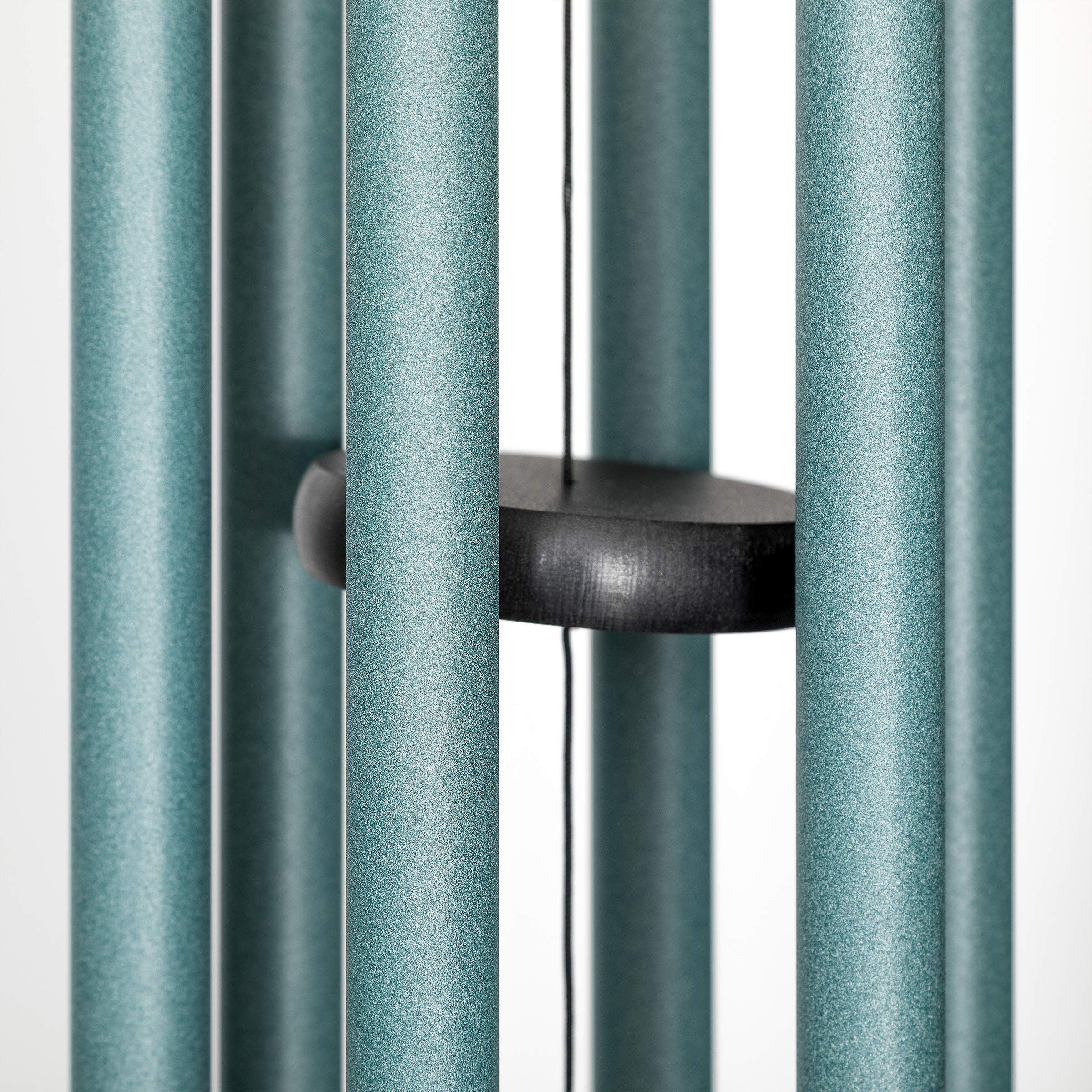Corinthian Bells patina green hanging on patio illustrating outdoor ambience benefit