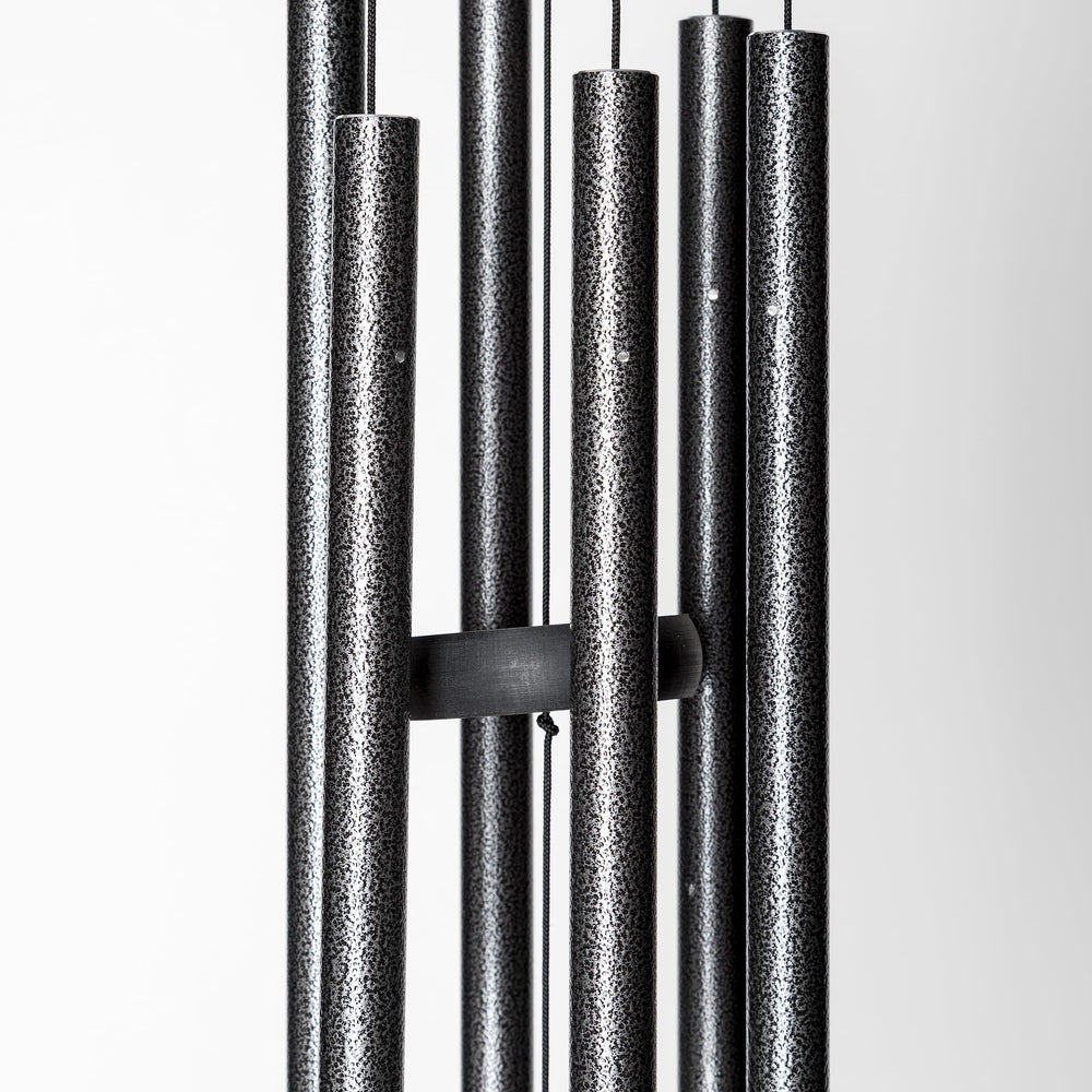 Corinthian Bells beside ruler showing 27-inch scale benefit: compact fit for small spaces
