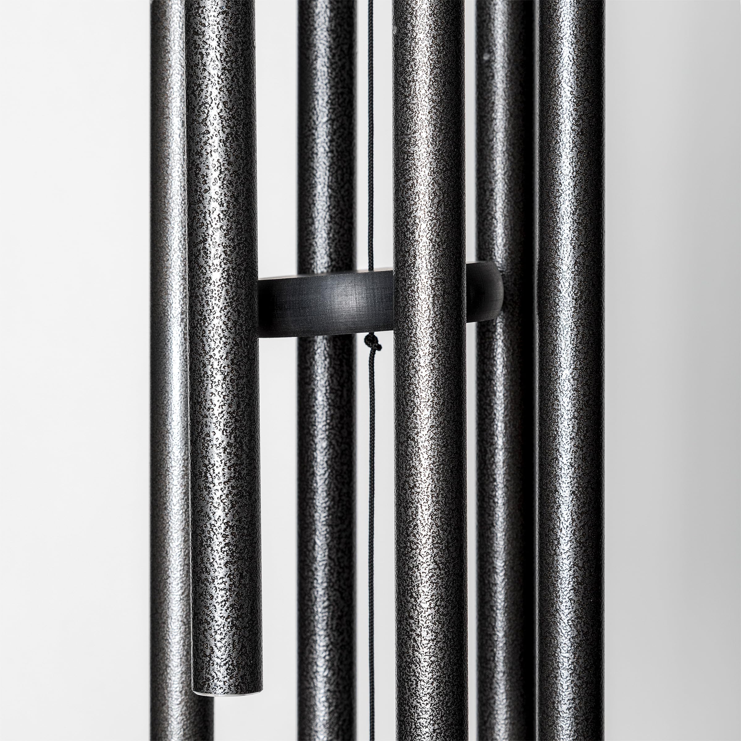 Corinthian Bells next to chair showing 30 inch overall length and scale