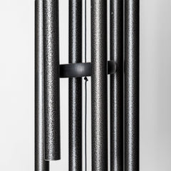 Corinthian Bells next to chair showing 30 inch overall length and scale