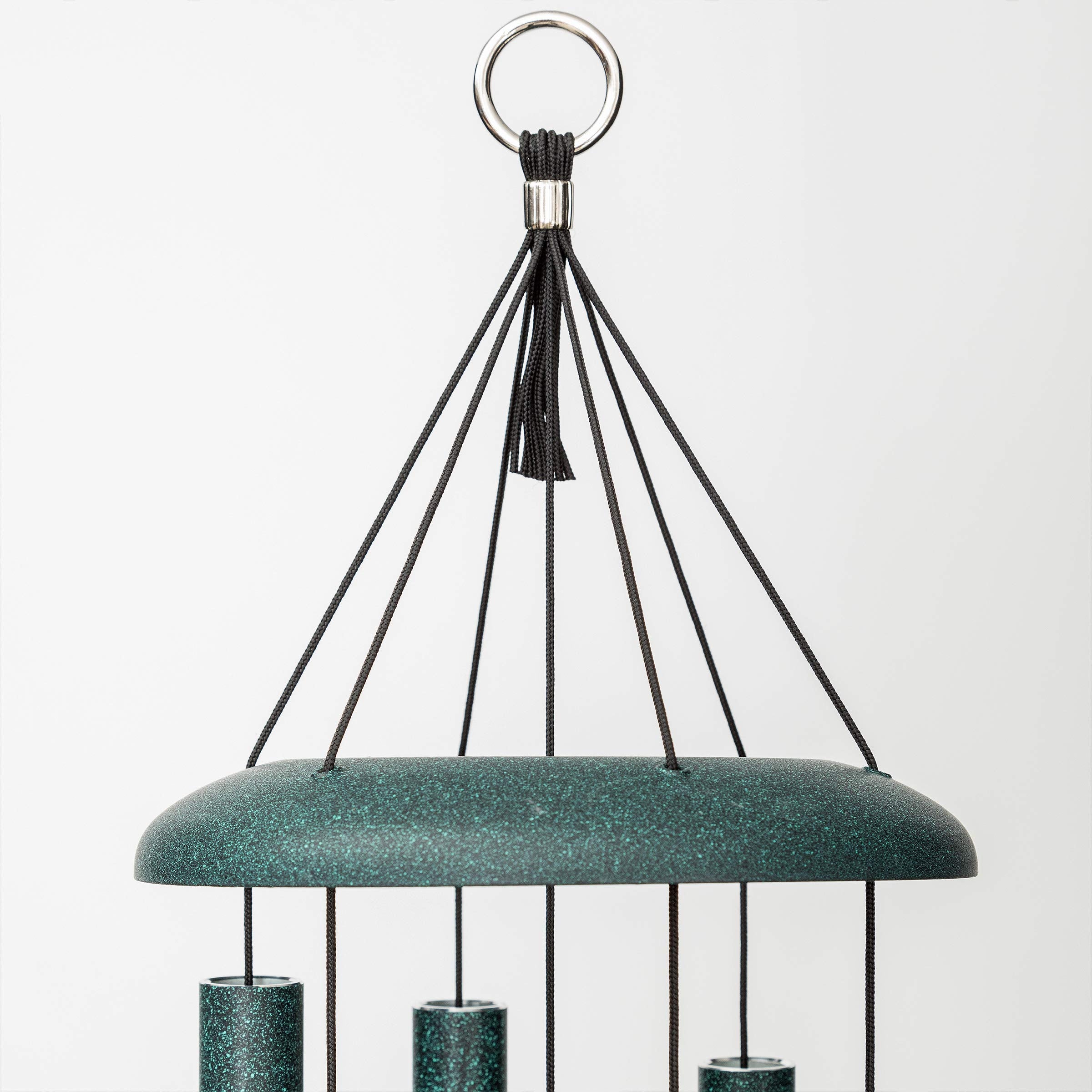 Corinthian Bells next to patio chair for scale showing 30-inch size and balanced tones