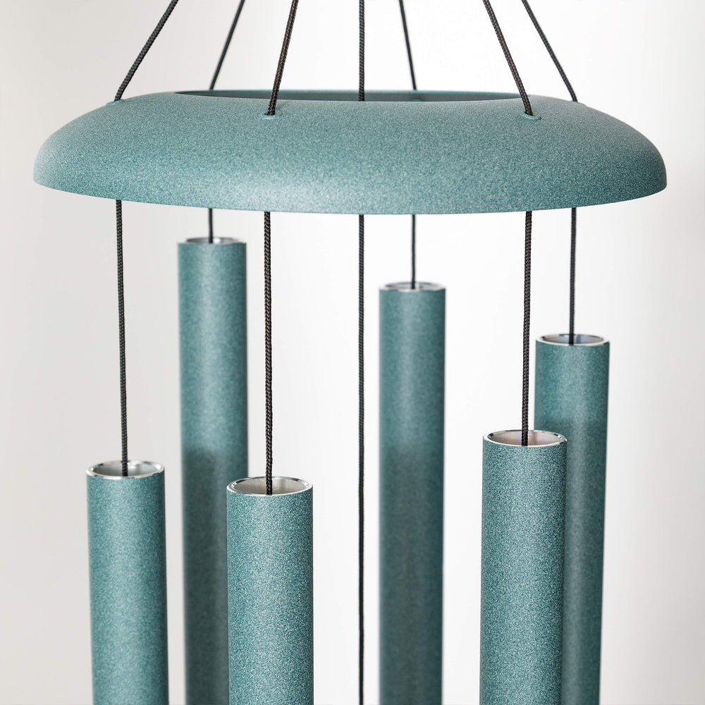 Corinthian Bells patina green wind sail detail showing redwood sail and sway stability
