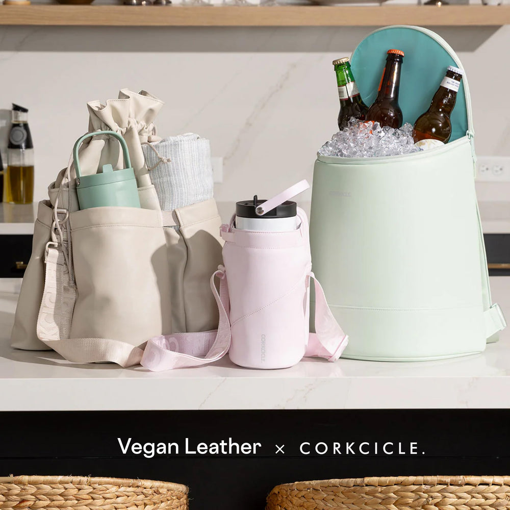Corkcicle EOLA next to wine bottles showing upright five-bottle capacity