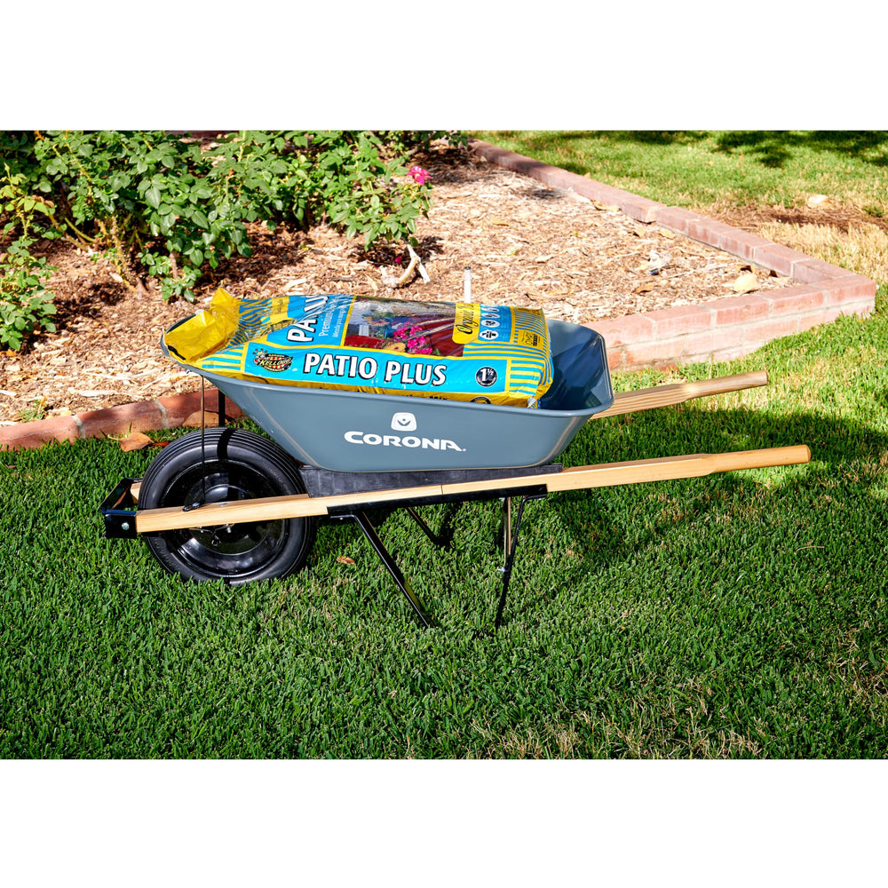 Corona Clipper in garden setting transporting plants for efficient outdoor work