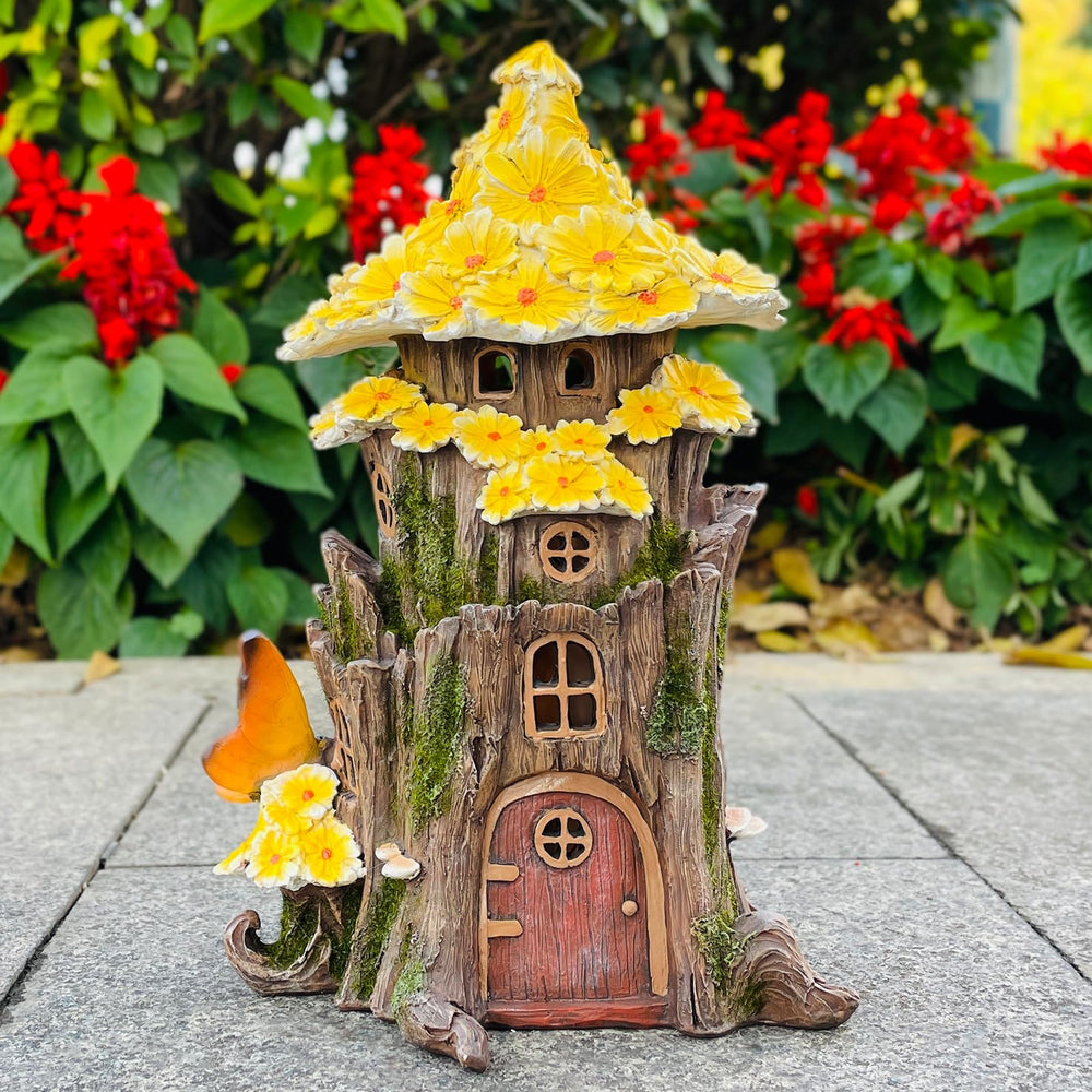 COWOS fairy house nestled in a flower bed enhancing garden mood lighting