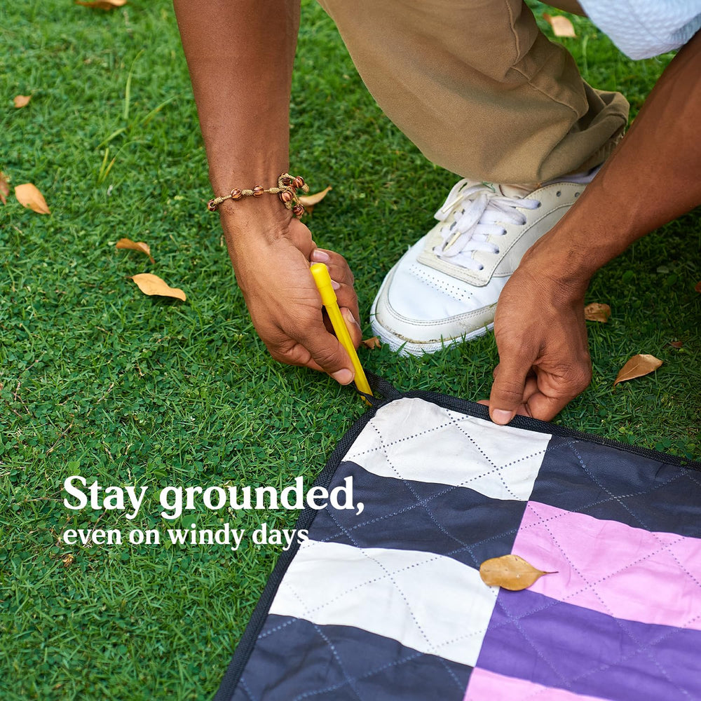 Cozy Club blanket spread on beach demonstrating sandproof ease
