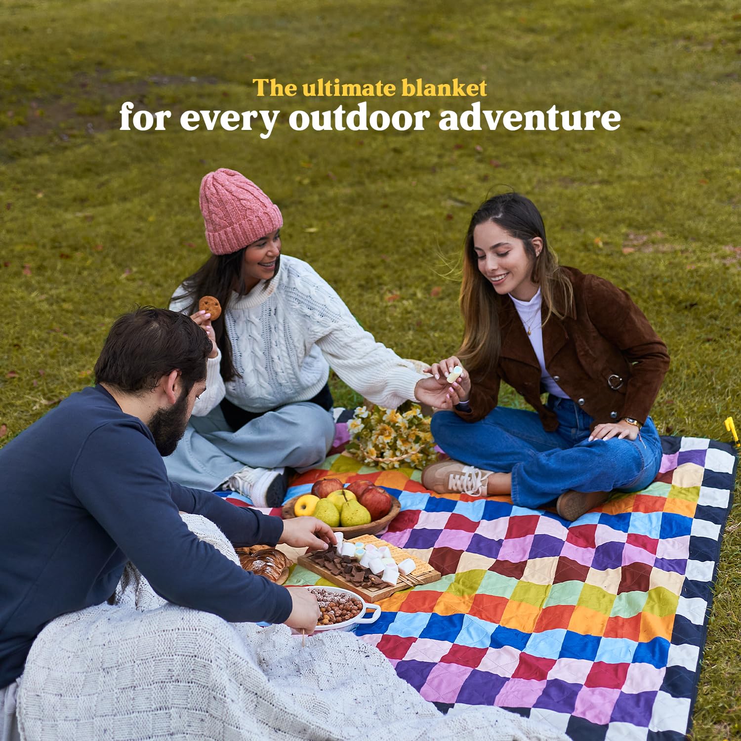 Cozy Club blanket beside backpack showing compact travel-friendly size
