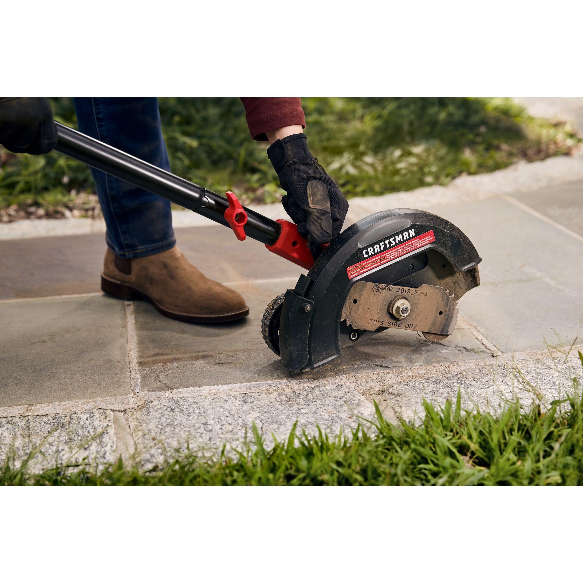CRAFTSMAN edger hung on VERSATRACK hook for organized garage storage