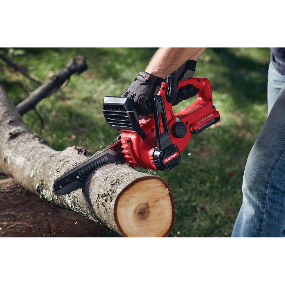 CRAFTSMAN saw next to 2x4 for scale demonstrating compact, handheld size