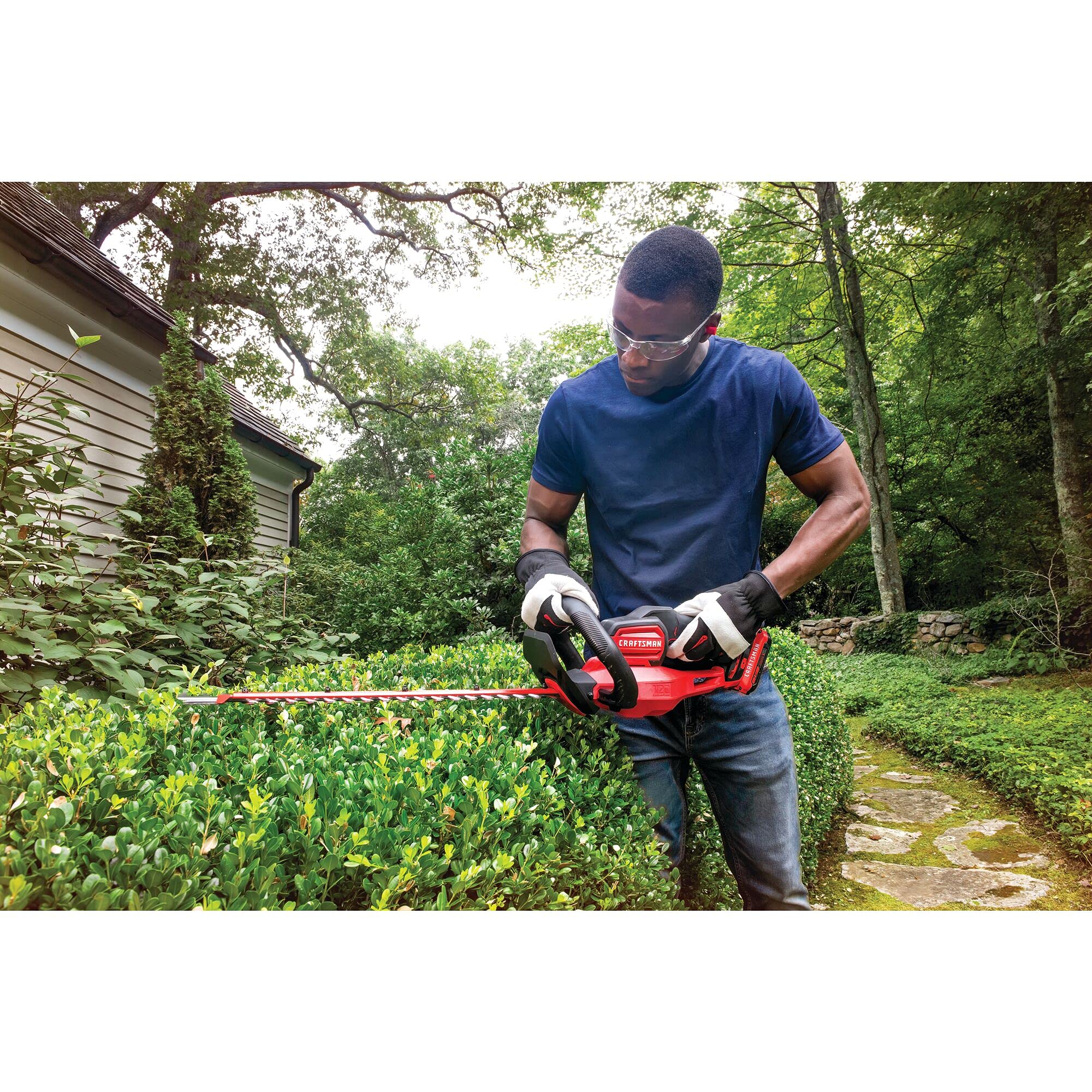 CRAFTSMAN blade cutting through shrub branch showing quick clean cut performance