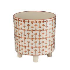 Creative Co-Op front view of rust and white footed planter showing pattern and shape, stylish accent