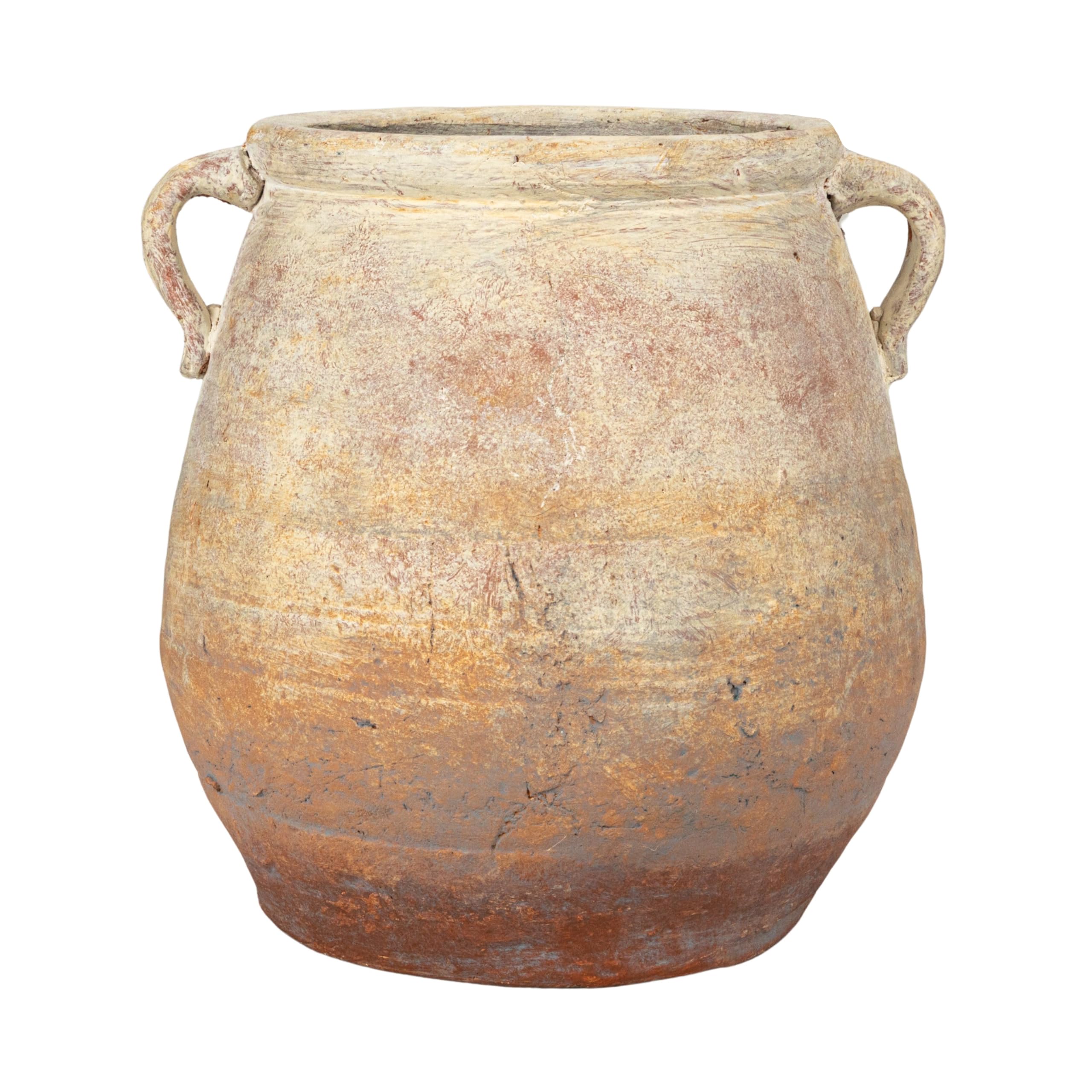 Creative Co-Op urn styled on patio adding vintage warmth to outdoor space