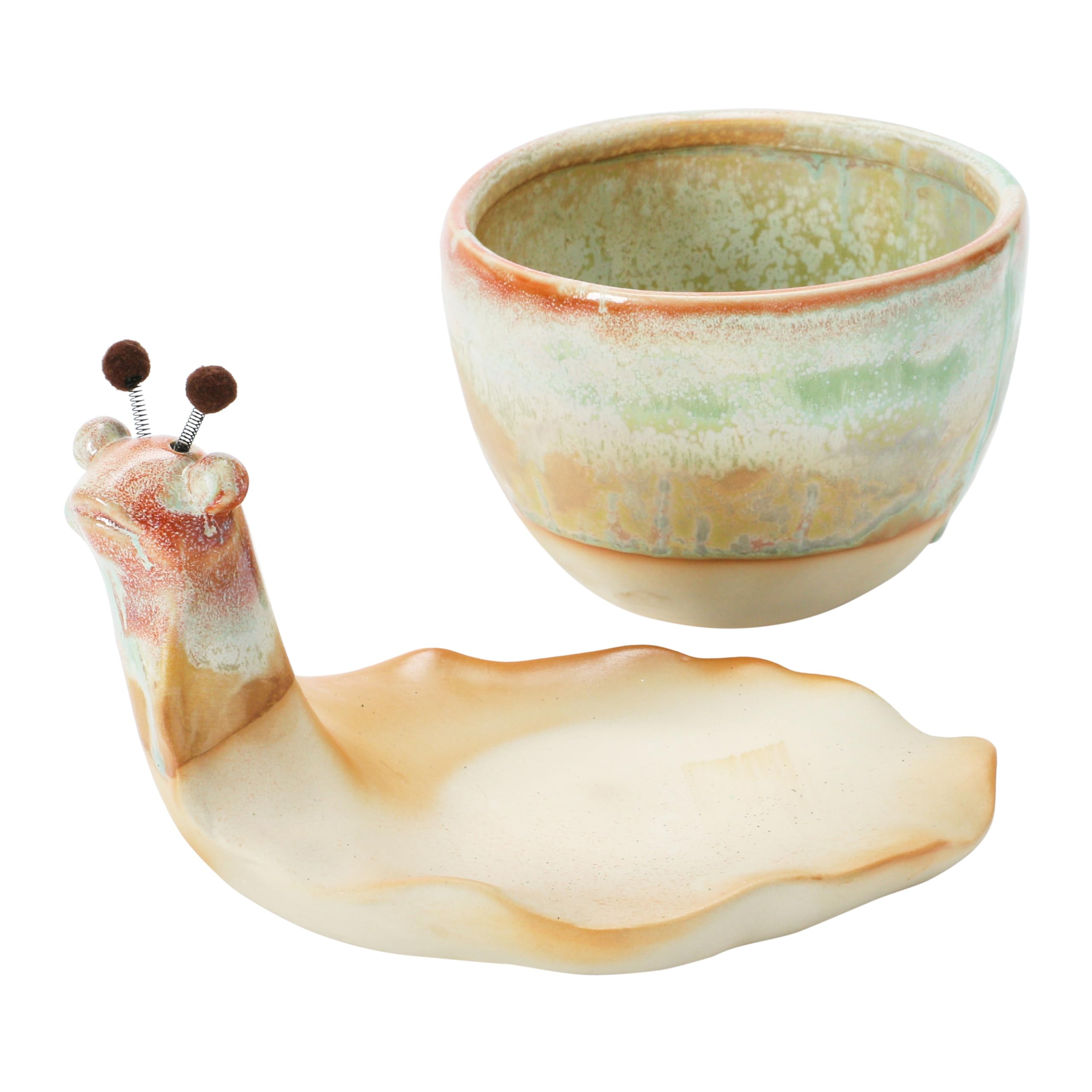 creative co-op succulent planted in snail on shelf adding whimsical decor