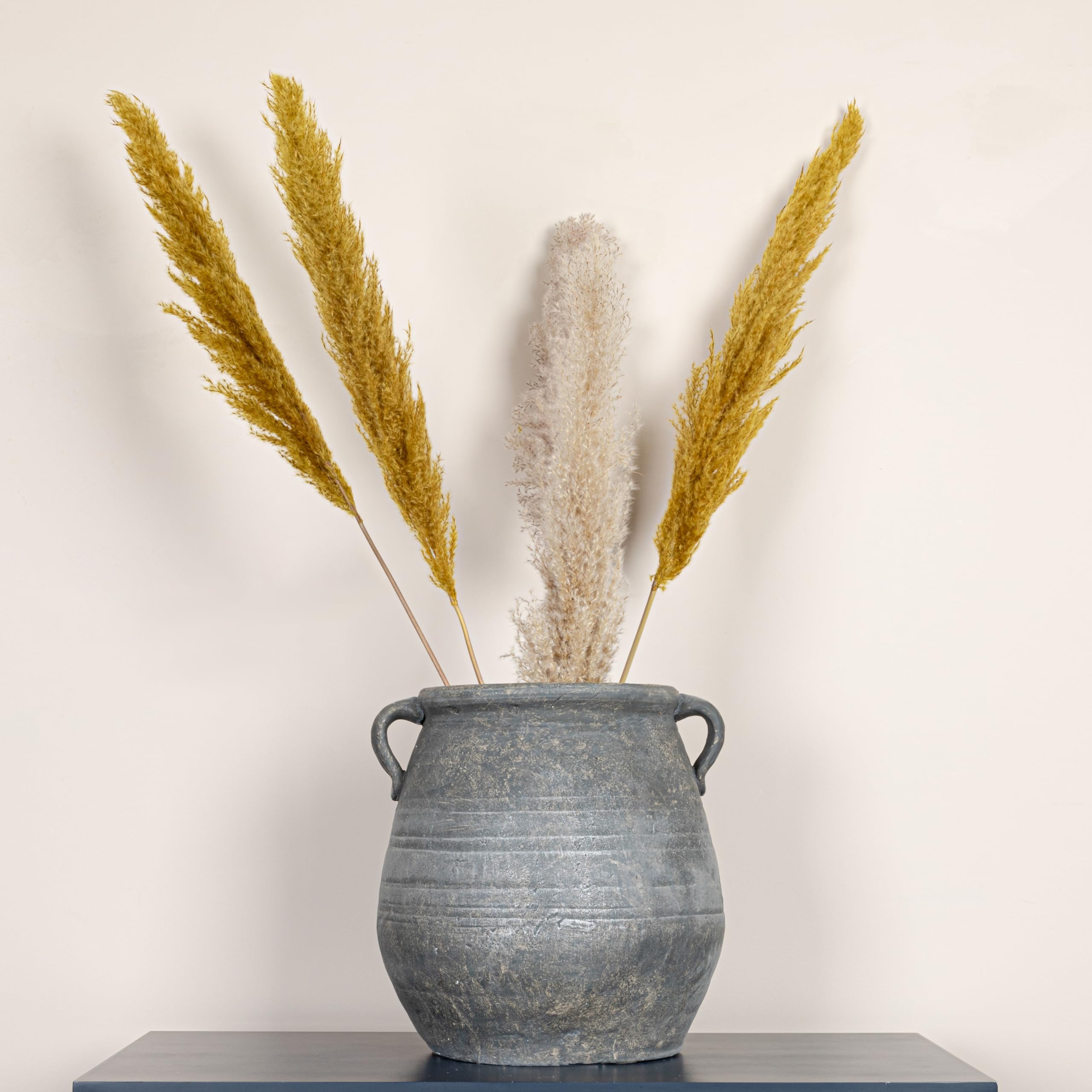 Creative Co-Op urn on patio creating cohesive outdoor focal point