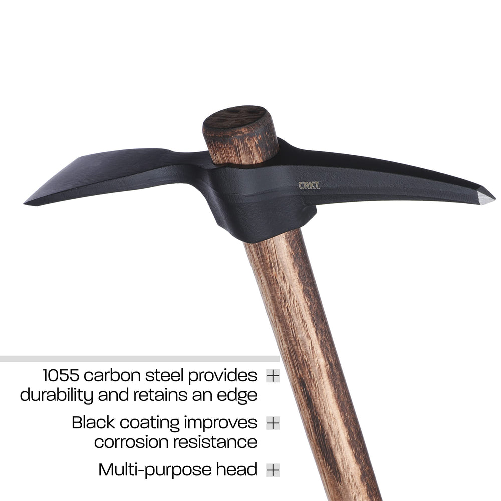 CRKT mattock in use breaking ground at campsite for efficient digging