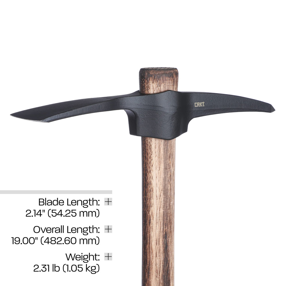 CRKT mattock next to hand to show scale and portable outdoor convenience