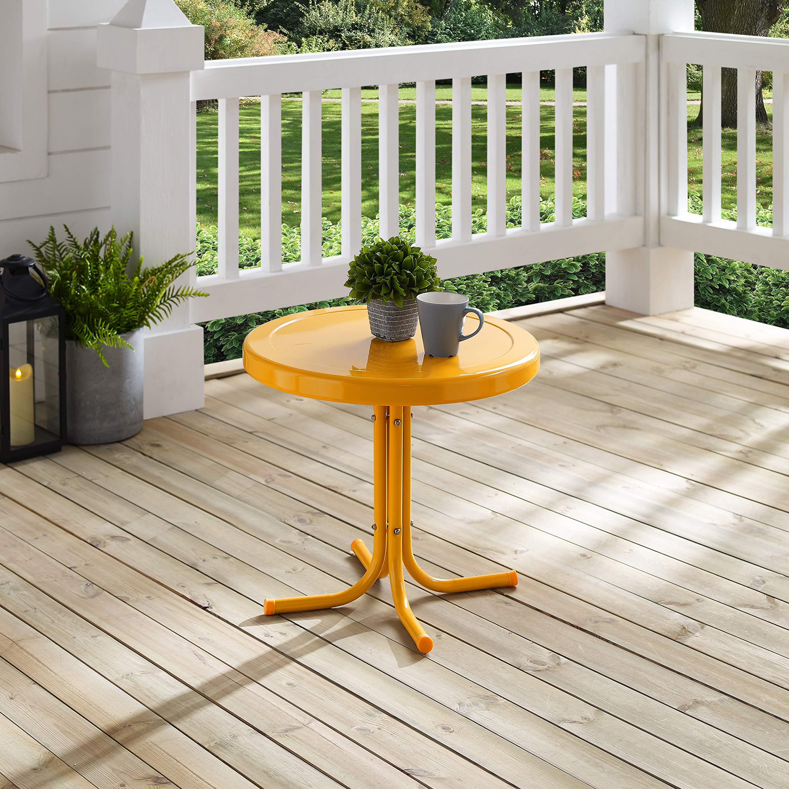 Crosley Griffith holding plant and lamp showing outdoor functionality