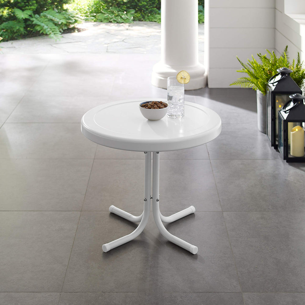 Crosley Griffith next to outdoor chair showing compact size and space-saving benefit
