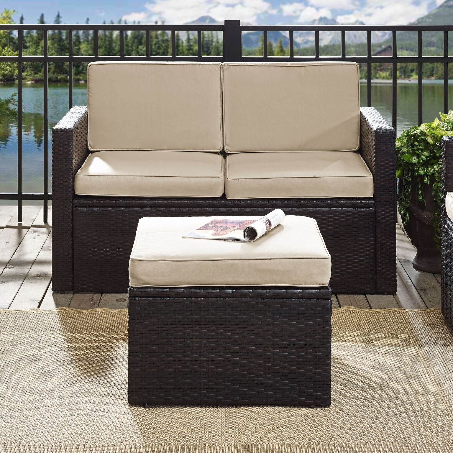 Crosley Palm Harbor ottoman next to chair showing scale and modular pairing