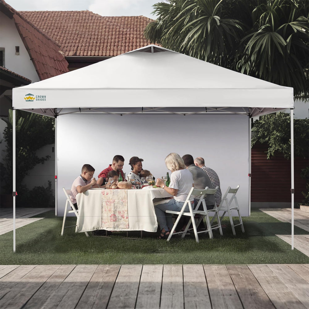 CROWN SHADES sidewall in market booth setting adds shade and privacy