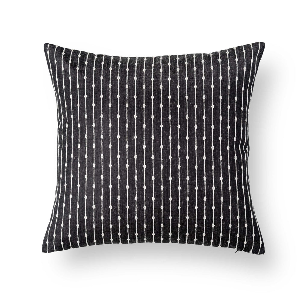 Crumbs Home on patio sofa illustrating durable style for outdoor and indoor use