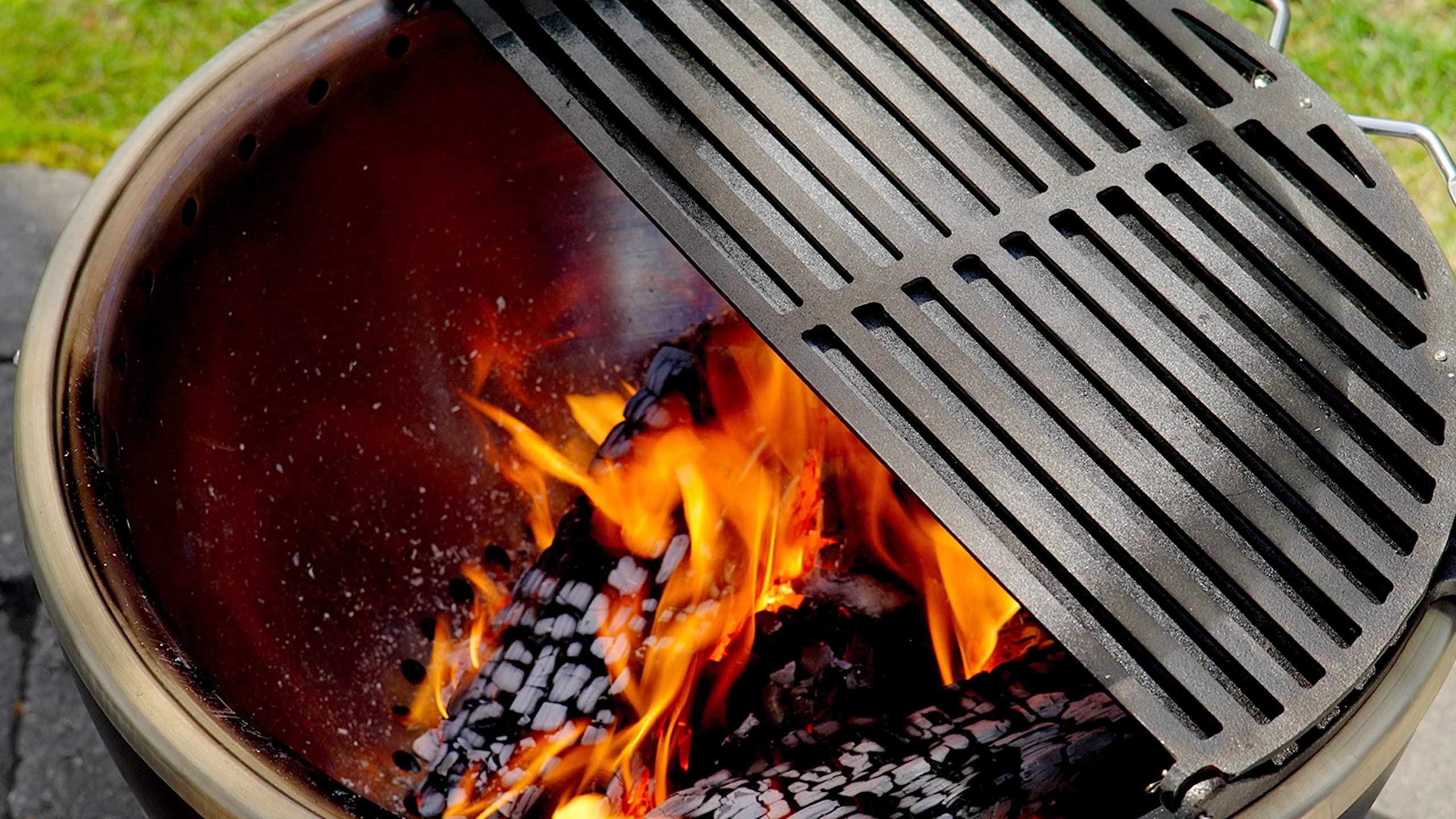 Cuisinart CHA-830 hinged open to expose coals for easy fuel access and temperature control