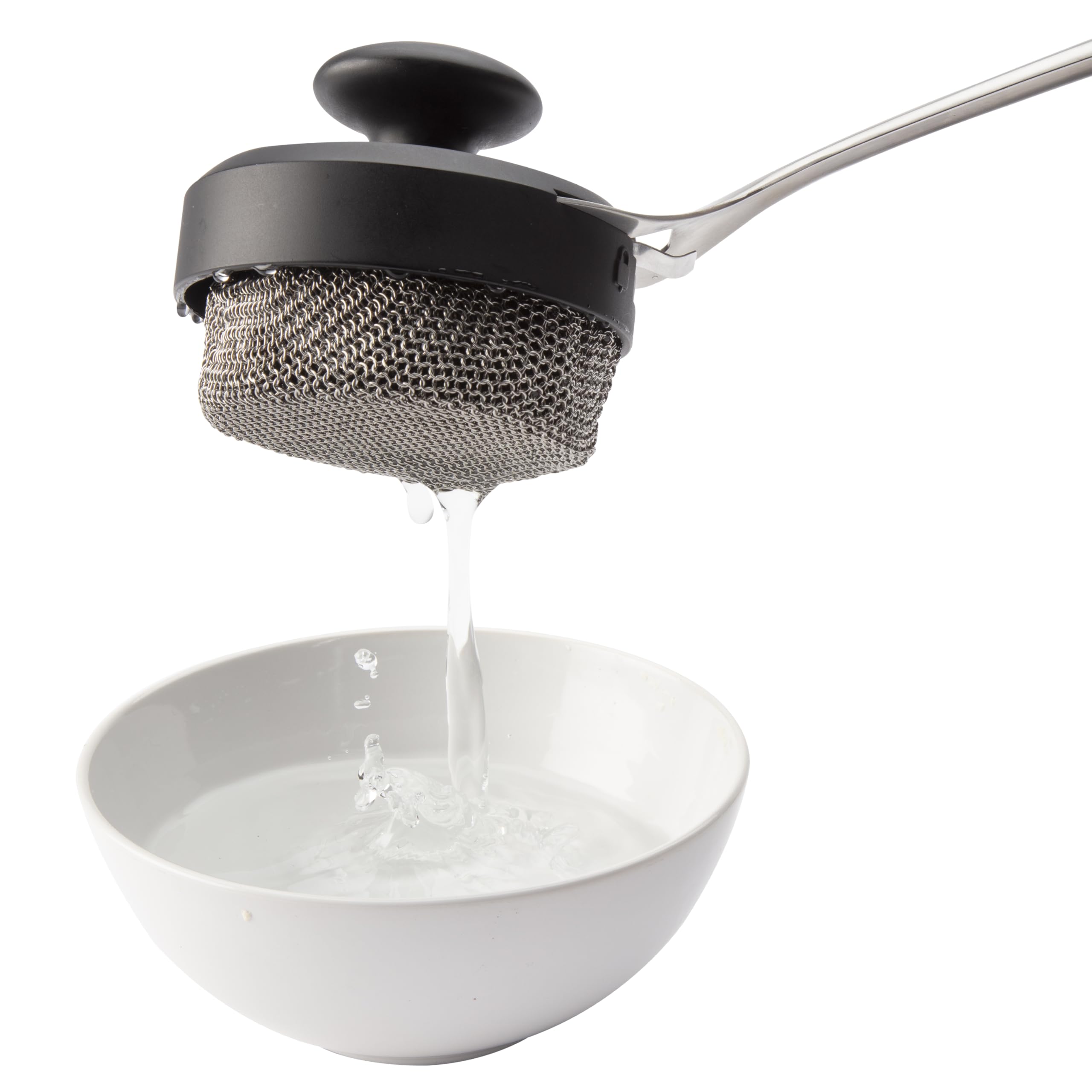Cuisinart chainmail head cleaning a cast-iron skillet for versatile cookware use