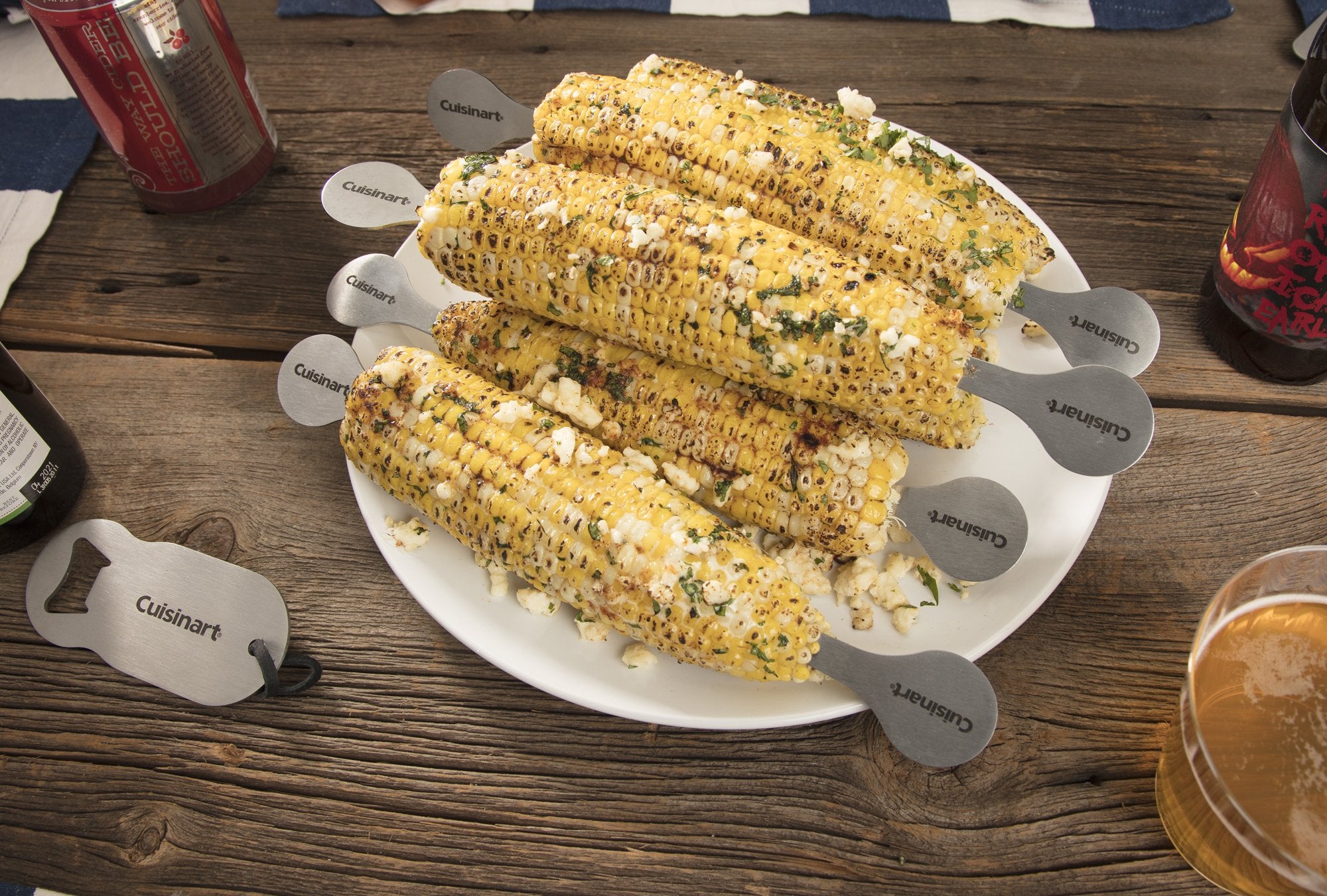 Cuisinart stainless corn holders inserted in hot corn for safe comfortable grip