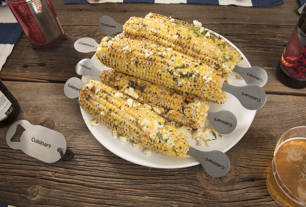 Cuisinart stainless corn holders inserted in hot corn for safe comfortable grip