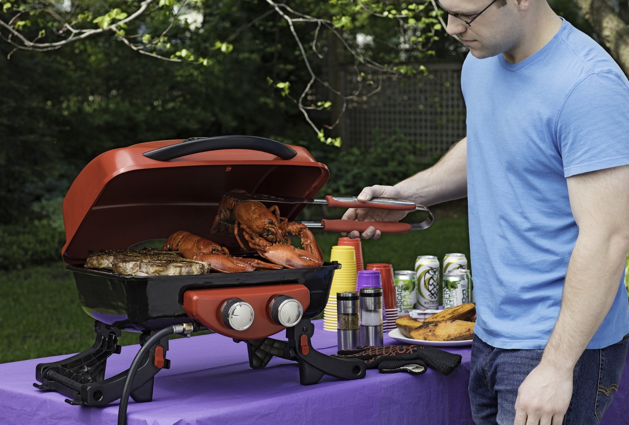 Cuisinart tools hanging from hook to show compact storage and fast access at the grill