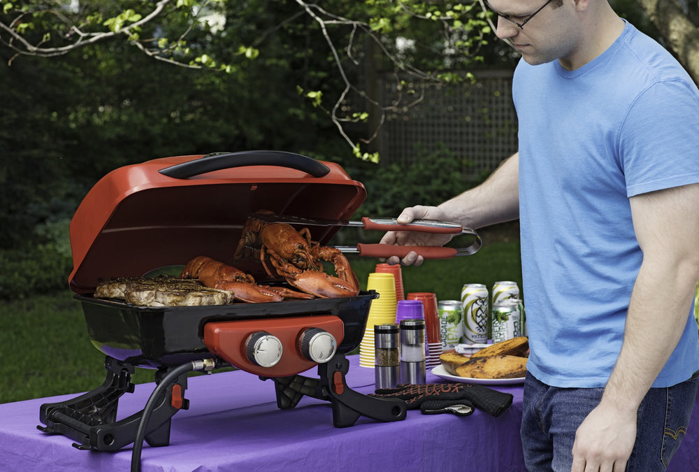 Cuisinart tools hanging from hook to show compact storage and fast access at the grill