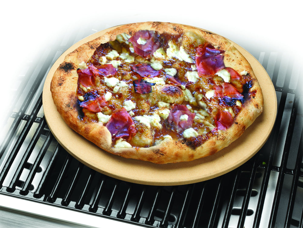 Cuisinart pizza stone on a grill with pizza in progress highlighting consistent bottom browning benefit