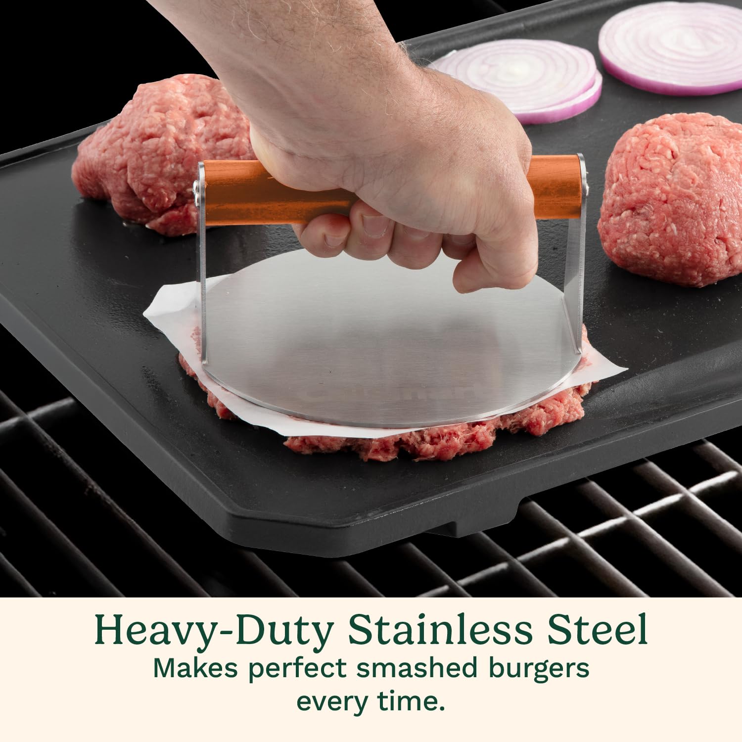 Cuisinart press flattening a patty on a hot griddle to create a caramelized crispy crust