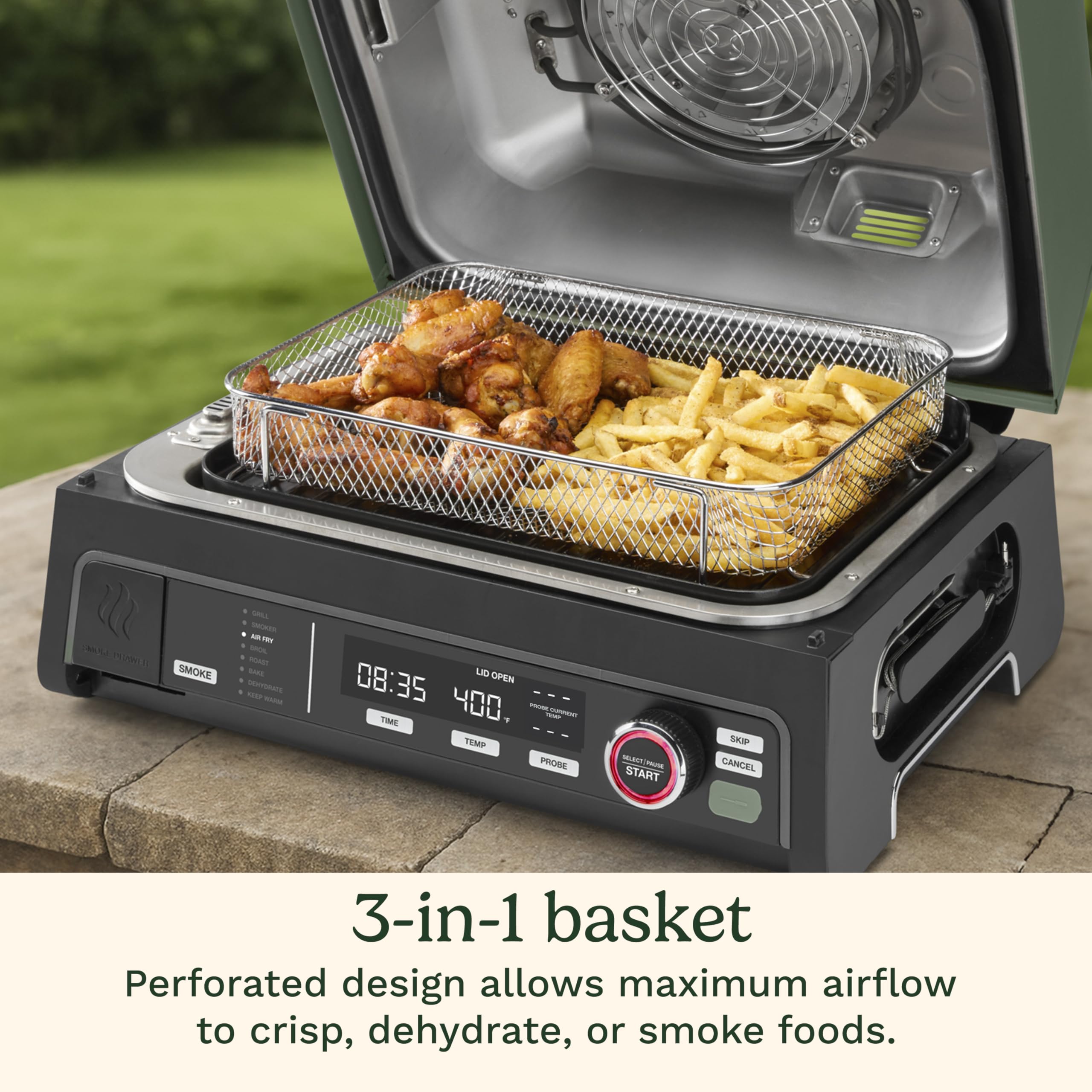 Cuisinart next to a chair for scale showing compact, portable outdoor-size