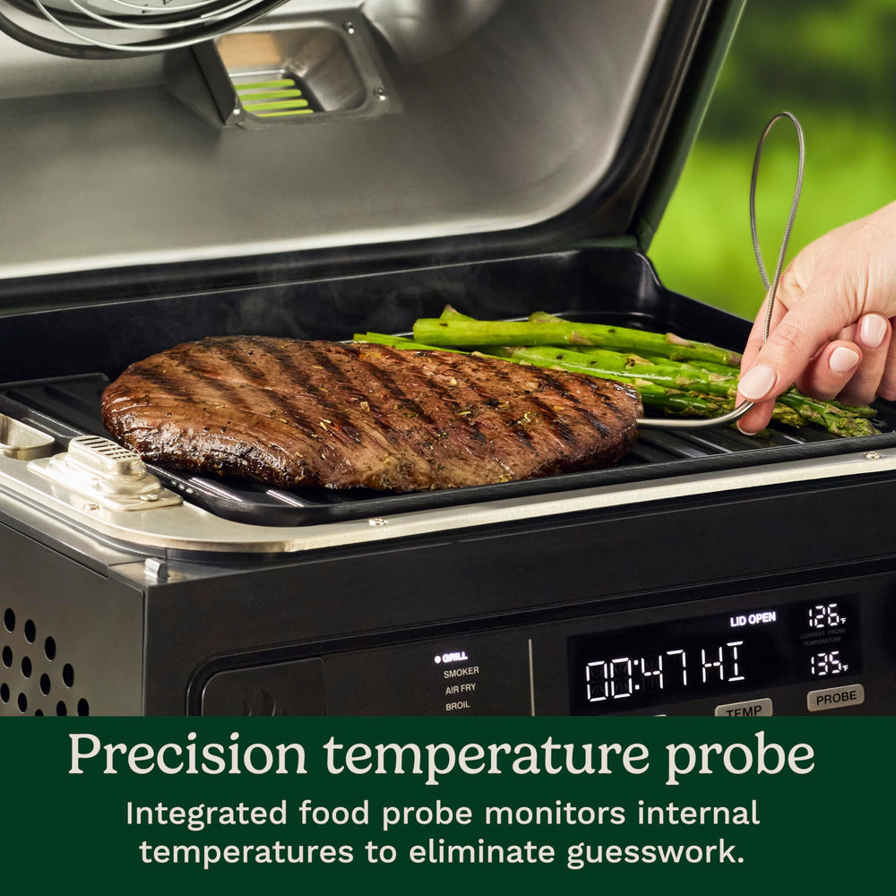 Cuisinart smart probe inserted in meat and display showing precise temperature control