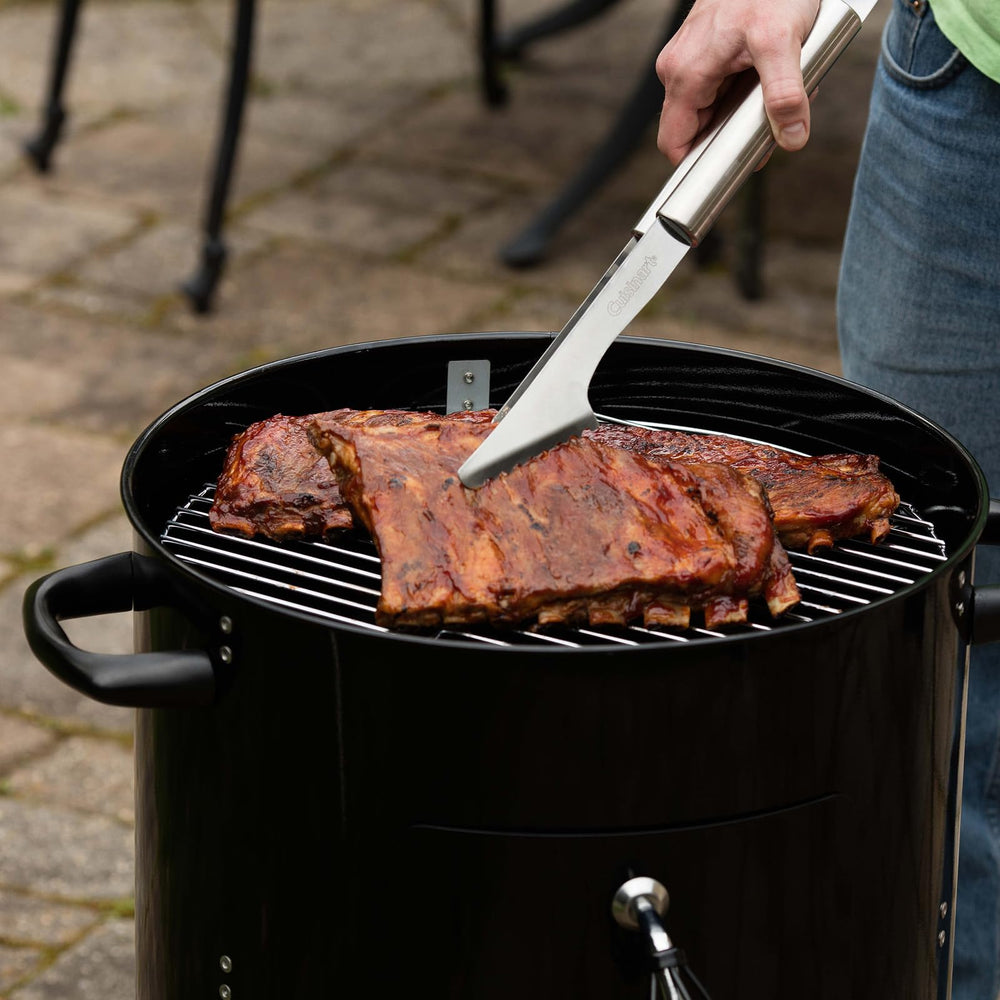 Cuisinart smoker on patio next to chair demonstrating compact footprint