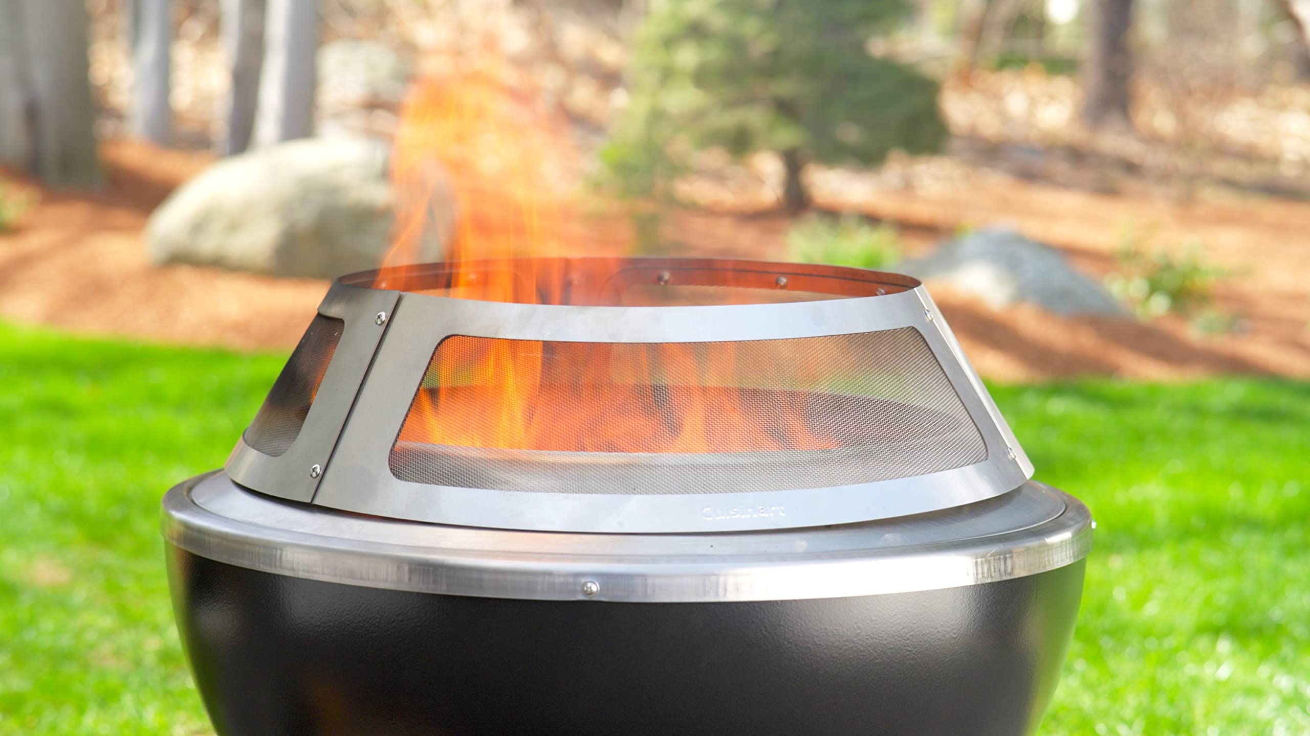 Cuisinart spark guard on fire pit in use containing sparks while maintaining flame view