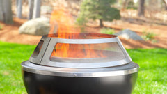 Cuisinart spark guard on fire pit in use containing sparks while maintaining flame view