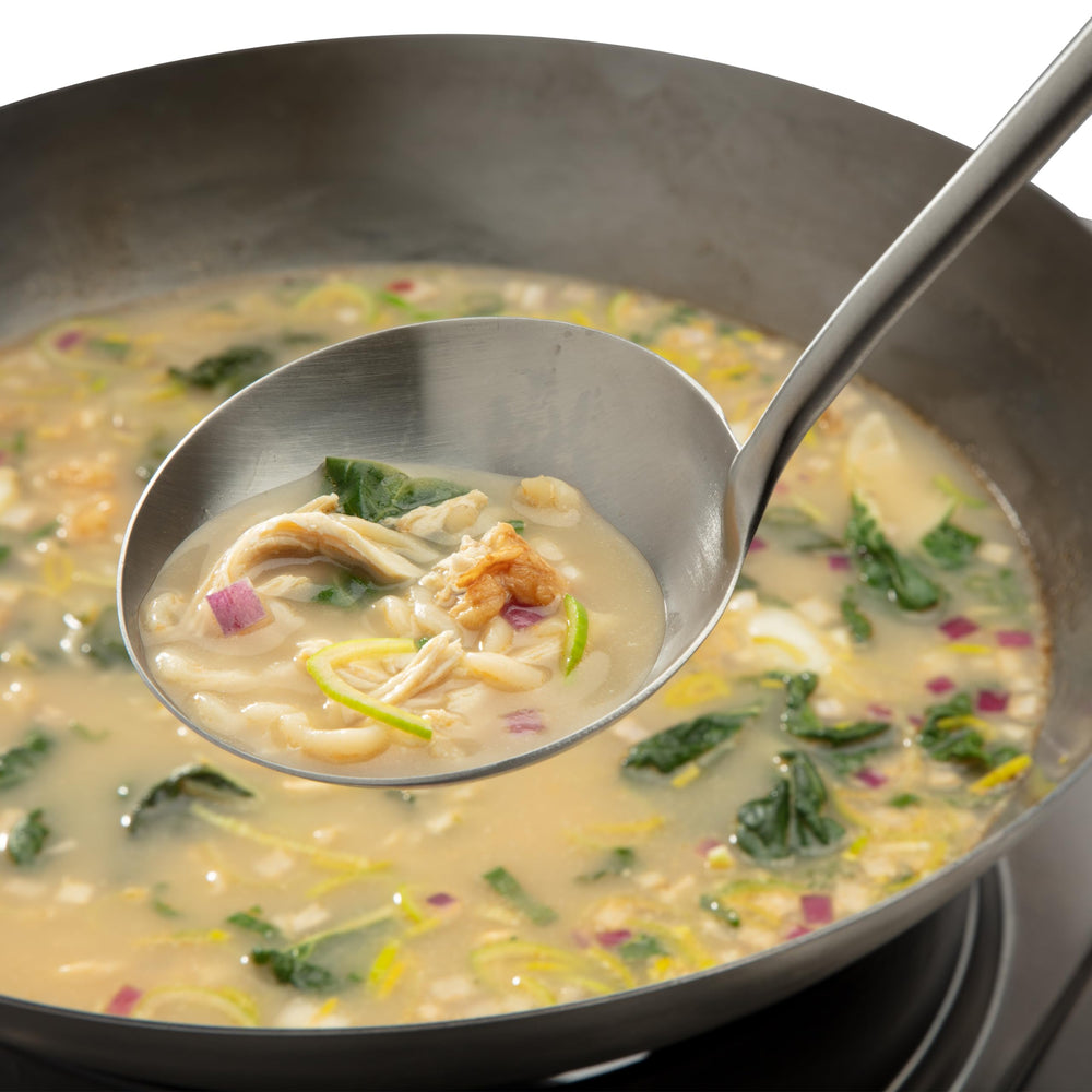 Cuisinart tools in wok showing smooth food movement along curved wok walls