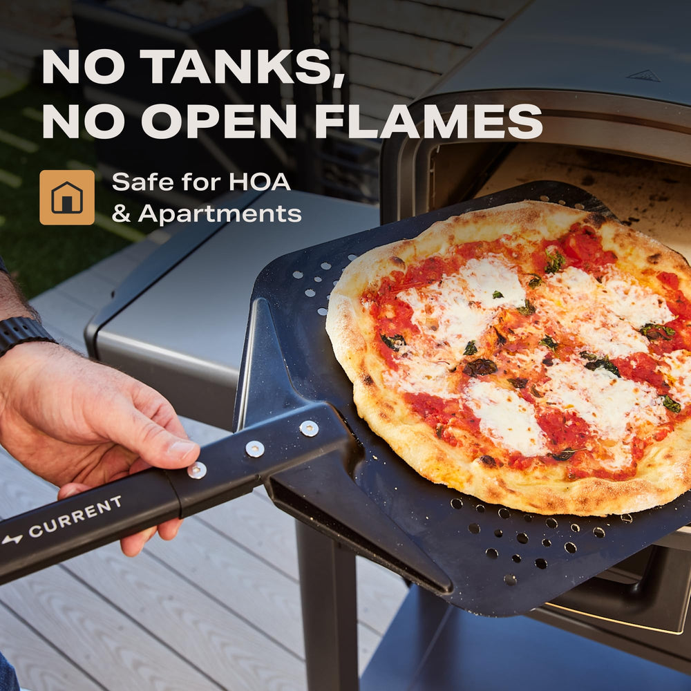 Current oven in use with pizza baking demonstrating rapid two-minute bake benefit